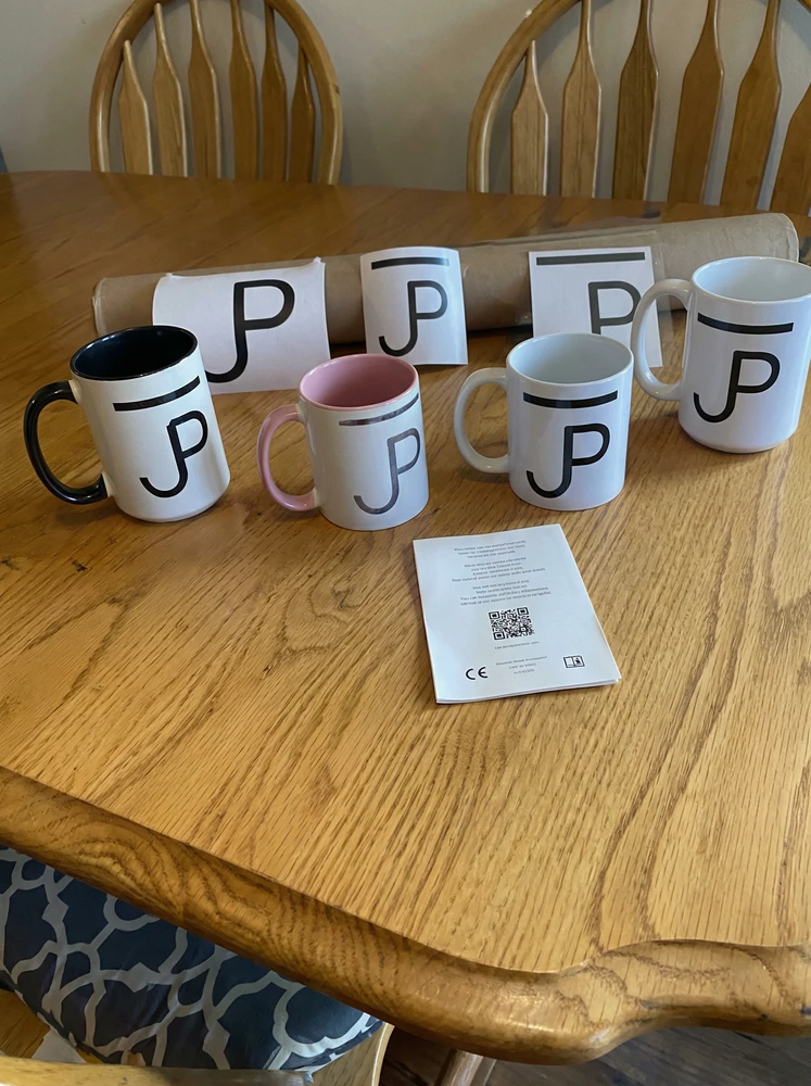 Mugs and decals made with a customer brand